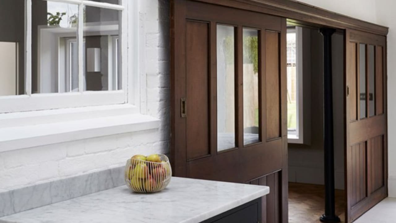 British Standard kitchen cupboards painted in a stylish midnight blue shade