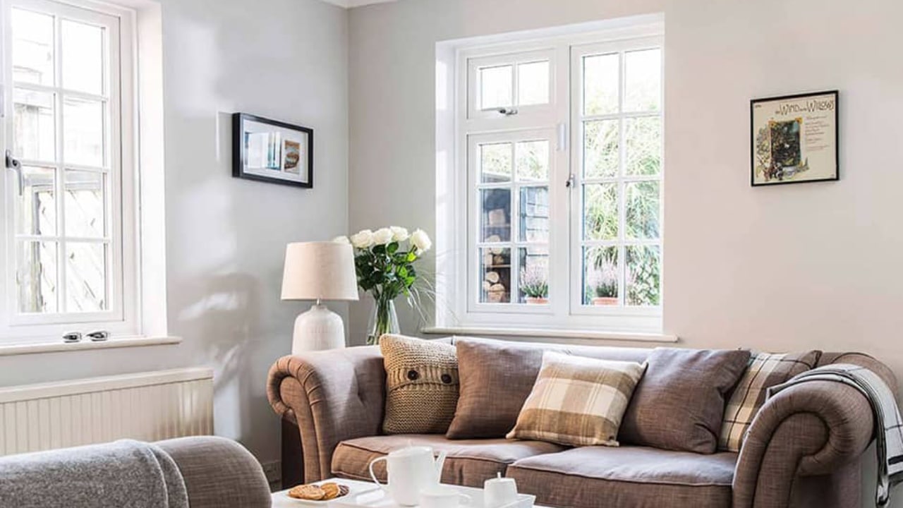 Anglian vs Everest. An Everest white uPVC casement window with Georgian bars.