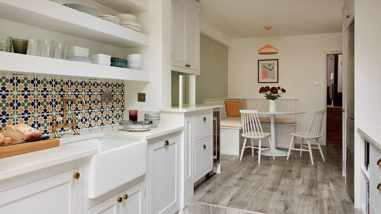 Modern, white Arbor kitchen with bespoke bench seating.
