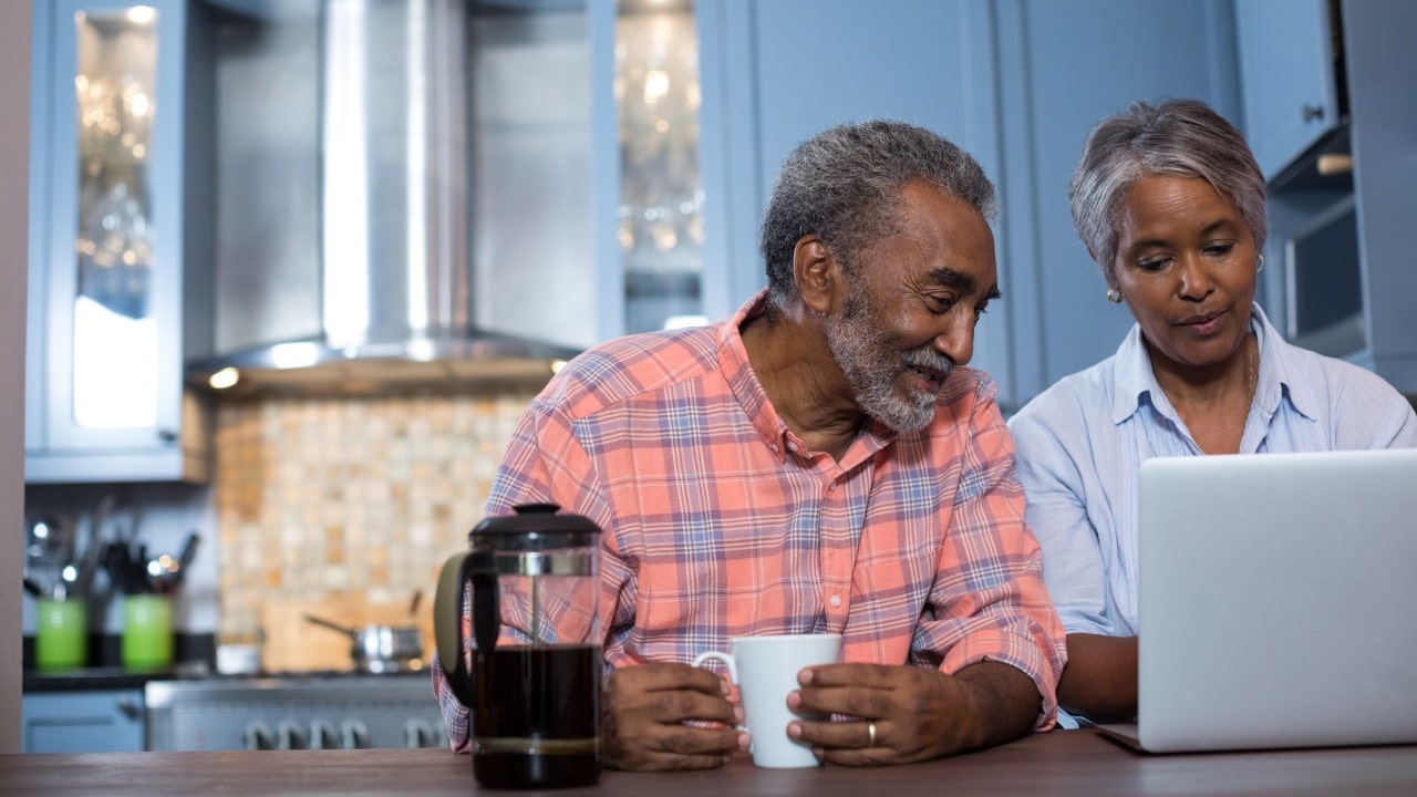 Cost of Living Payments older couple looking at computer